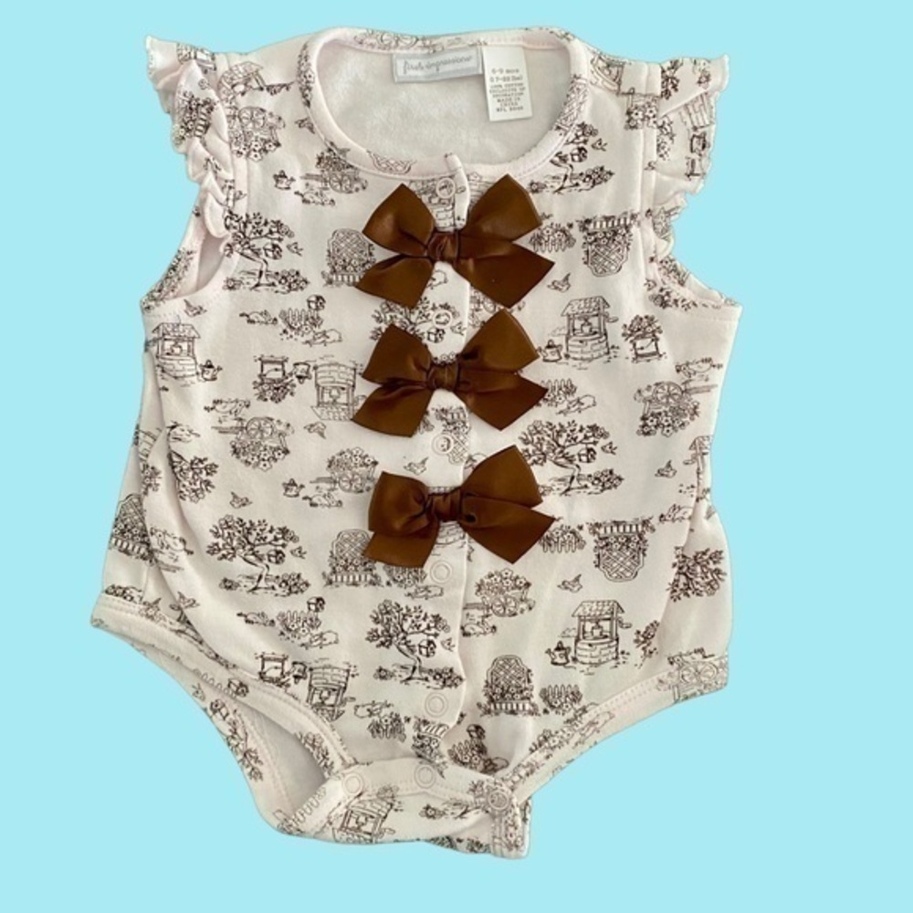 First Impressions onesie